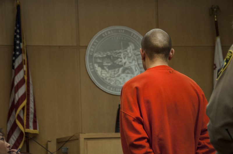 Nikhom Thephakaysone stands in front of Judge Tracie Brown in the San Francisco Superior Court's Hall of Justice during a court hearing Thursday, March 27. Thephakaysone is facing felony counts that include assault with a deadly weapon, posession of an illegal firearm and the murder of Justin Valdez. Photo by Jessica Christian / Xpress