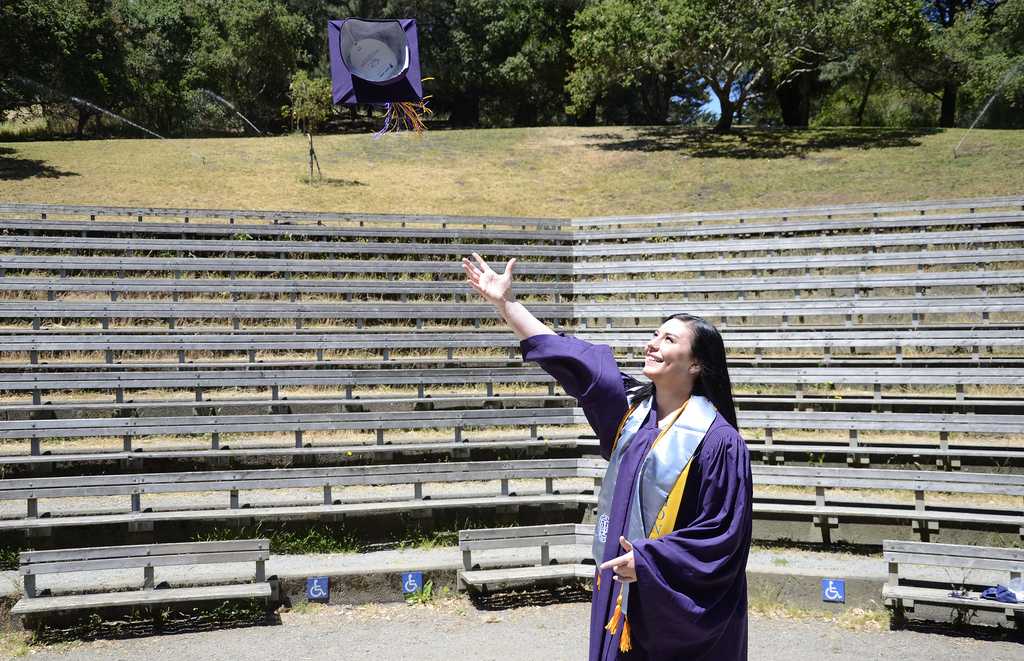 Lea Lunden, soon-to-be SF State psychology graduate, stands in the Jerry Garcia Amphitheater in McLaren Park. This amphitheater is the alternate location for the psychology department's graduation on Saturday, May 25 for SF State psychology students. This graduation, thought up and organized by Lunden, is not supported by the department and tickets for this ceremony are $15 rather than the $85 for the ceremony that will be held on the Hornblower. Photo by Virginia Tieman / Xpress