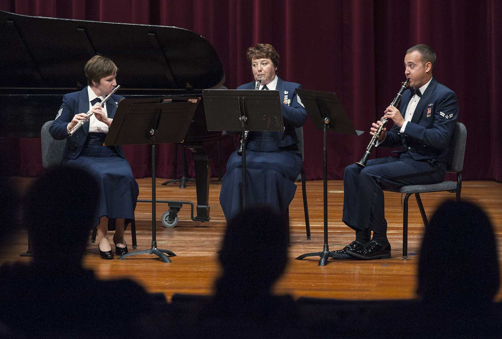 Technical Sergeant Elizabeth Honaker (Flute), Master Sergeant Coreen Levin (Oboe) and Airman First Class Brian Wilmer (Clarinet) play Divertimento for Flute, Oboe and Clarinet, Op. 37 by Sir Malcolm Arnold at a performance by The United States Air Force Band of the Golden West in Knuth Hall. Friday, September 27, 2013. Photo by Benjamin Kamps / Xpress