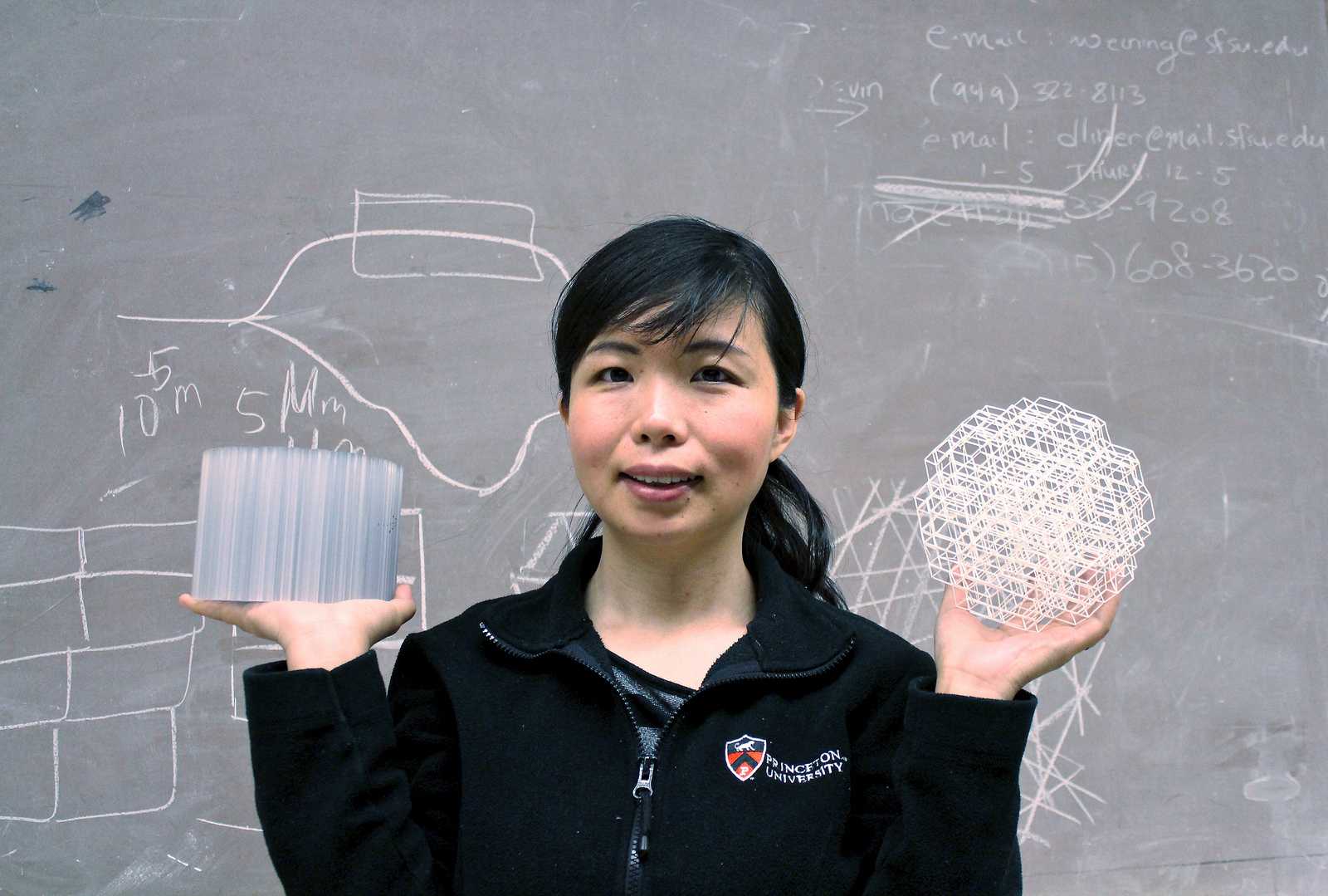 Dr. Weining Man holds two models of Isotropic Disordered Photonic Band Gap Structures in her laboratory on Tuesday, Sept. 24, 2013. Dr. Man was recently awarded a 400k grant by the National Science Foundation. Photo Ryan Leibrich / Xpress