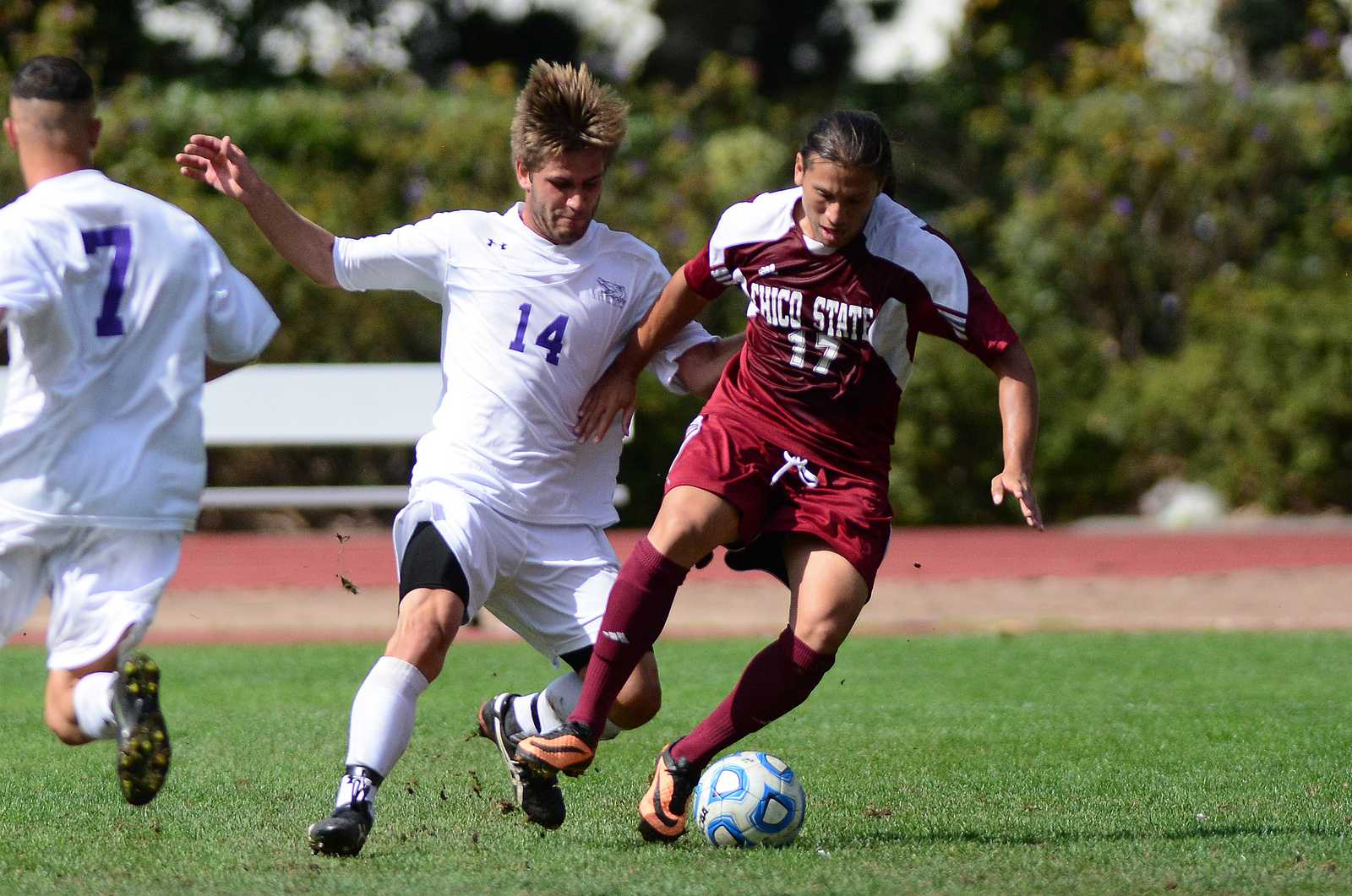 Nathan Fernandez (14) pursues the ball alongside Octavio Guzman (17) during a game against Chico State at Cox Stadium, Oct. 6, 2013. The Gators lost the game 0-1. Photo by Philip Houston / Xpress