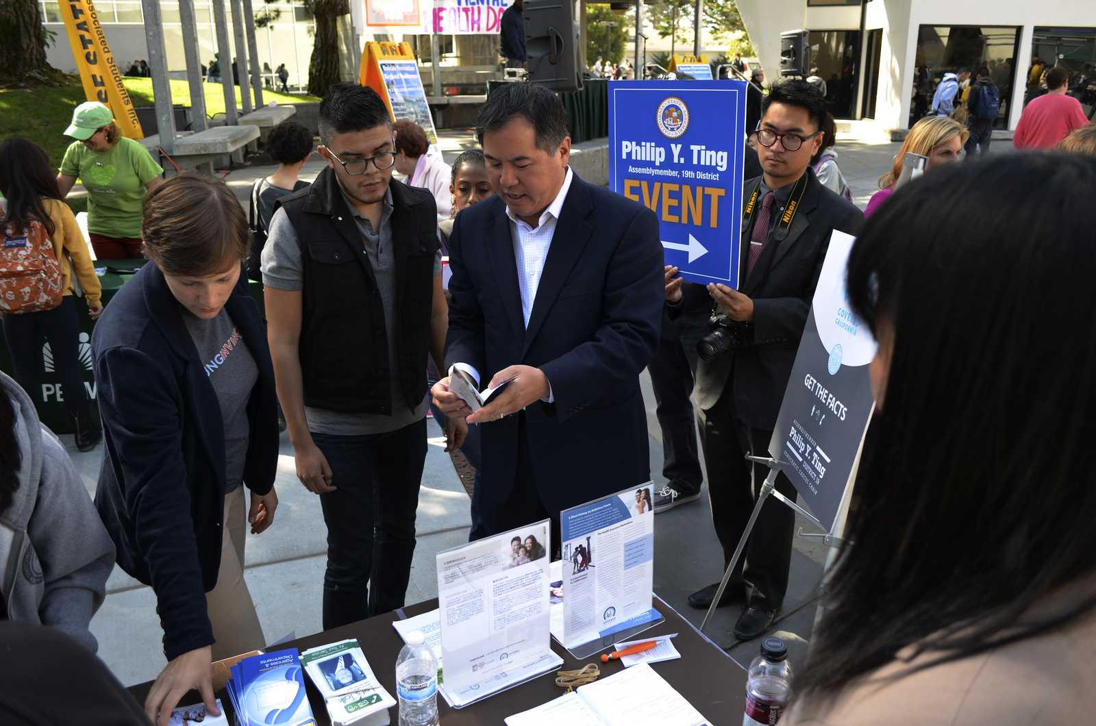 Ariel Boone and assembly member of district 19, Philip Y. Ting help explain the Affordable Care Act to SF State students at Cesar Chavez Plaza during an event Thursday, Oct. 10, 2013 in the afternoon. Photo by Amanda Peterson / Xpress 