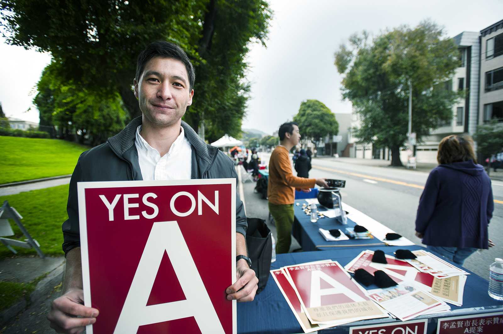 Nicholas Lucas campaigns for prop A protecting San Francisco retirees during a Sunday Street event on Arguello boulevard on Sunday, Oct. 27, 2013. Photo by Benjamin Kamps / Xpress