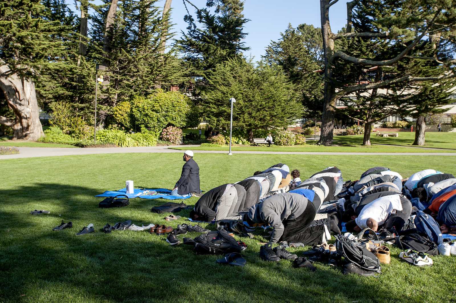 Imam Amir Abdul Malik leads the attendees in the closing prayer of Jumaa Under the Sun Friday, Nov. 15, 2013. Photo by Benjamin Kamps / Xpress