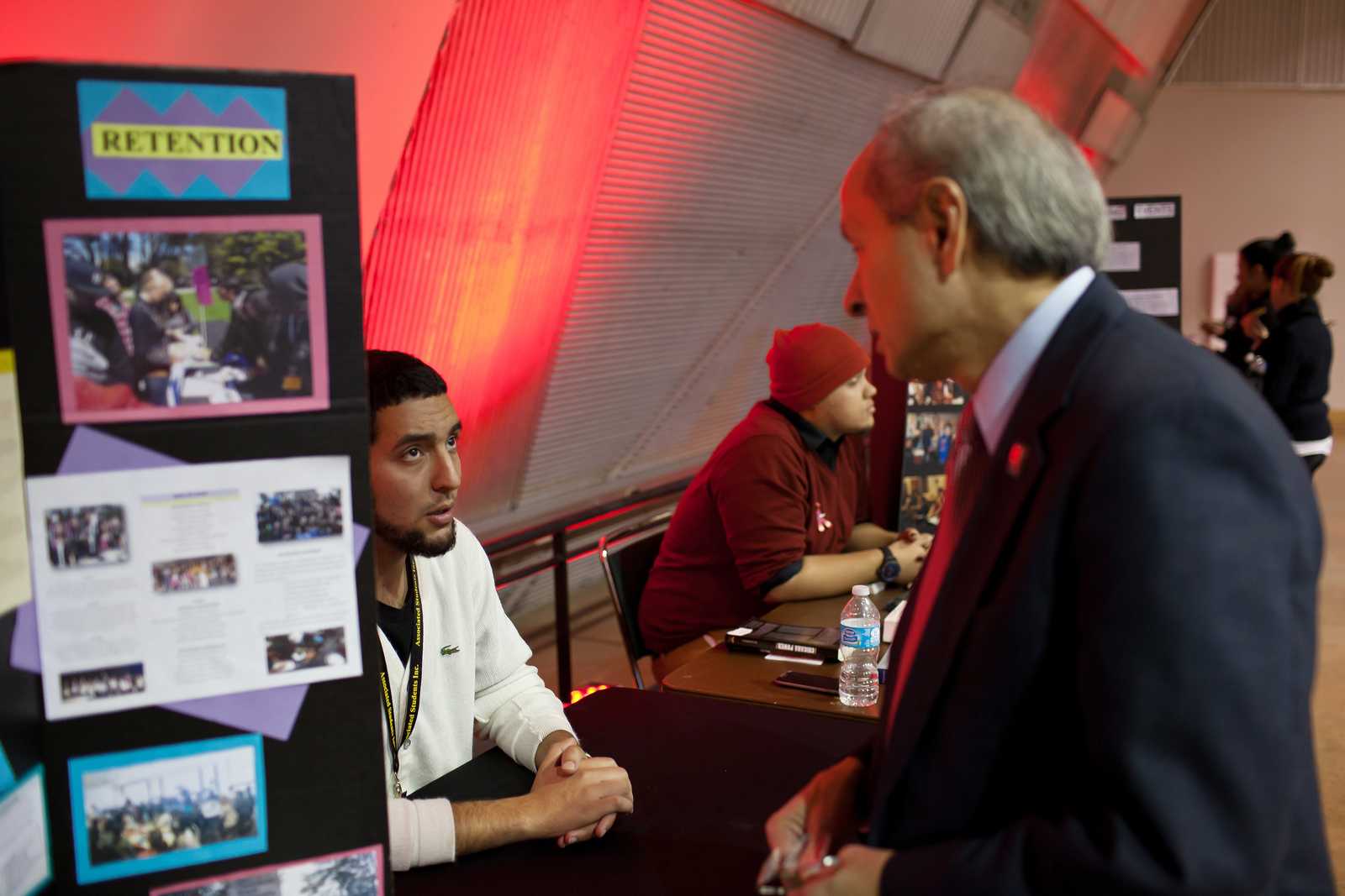 Issa Ibrahim, business major with ASI Project Connect, discusses scholarships with President Leslie E. Wong at the World AIDS Day event at SF State on Tuesday, Dec. 3 2013. The event is part of a global effort to increase awareness which occurs annually on the first of December. Photo by Dariel Medina / Xpress