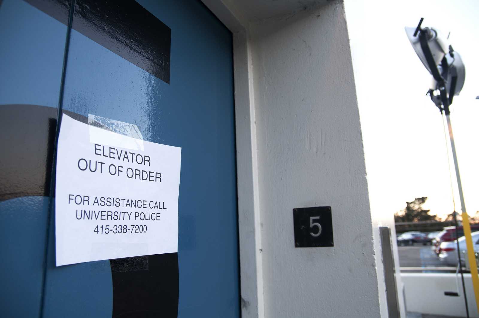 An out of order sign is displayed on an SF State Lot 20 parking structure elevator during a power outage that occurred Monday, Dec. 9, 2013. The elevators are expected to remain out of order on Tuesday, Dec. 10, 2013, but the rest of the structure now has power. Photo by Jessica Christian / Xpress