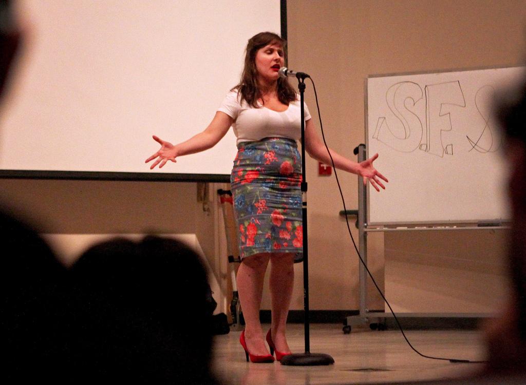 S.P.E.A.K. SFSU's Becky Raeta performs "To My Father" during the Battle of the Bay Poetry Slam  in the Humanities Auditorium Friday, Feb. 28.